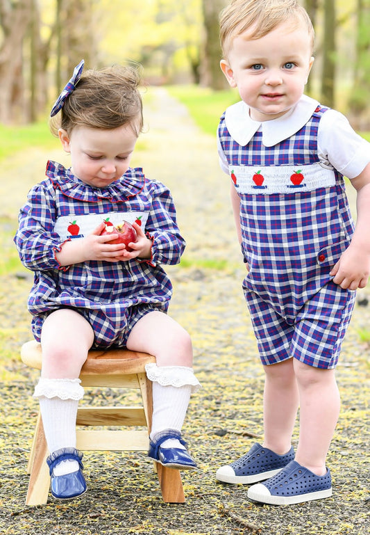 Photo features two full body shots of models. On the left is the featured Apple of my Eye Boy's Jon Jon. On the right is model wearing our Apple of my Eye Girl's Bubble.